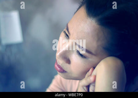 Asian woman worker suffering from hurt,fatigue, pain at neck, muscle, stressed during working with laptop for a long time, Stock Photo