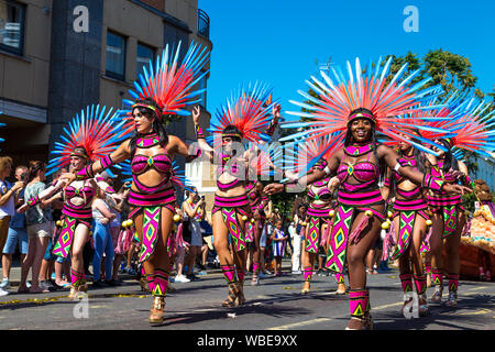 26 August 2019 - group of samba dancers wearing Native American inspired costumes, Notting Hill Carnival on a hot Bank Holiday Monday, London, UK Stock Photo