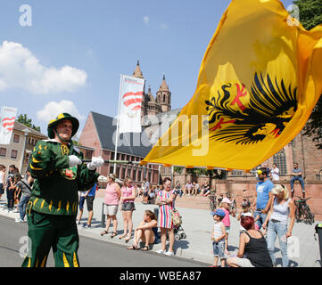 Worms, Germany. 25th August 2019. A colour guard of the Fanfare Corps of the city of Worms marches in the parade. The first highlight of the 2019 Backfischfest was the big parade through the city of Worms with over 70 groups and floats. Community groups, music groups and businesses from Worms and further afield took part. Stock Photo