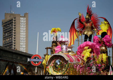 London, UK. 26th Aug, 2019. Revellers perform during a parade of the 2019 Notting Hill Carnival in London, UK, on Aug. 26, 2019. Originated in the 1960s, the carnival is a way for Afro-Caribbean communities to celebrate their cultures and traditions. Credit: Tim Ireland/Xinhua Credit: Xinhua/Alamy Live News Stock Photo