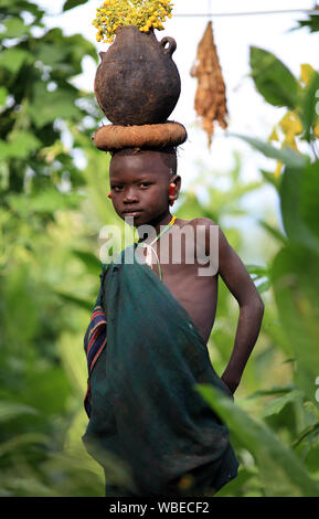 Young tribal Suri boy at a ceremony in Lower Omo Valley near Kibish, Ethiopia Stock Photo