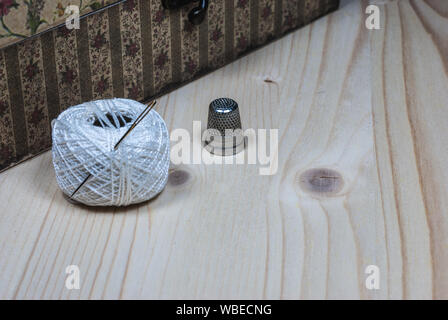 SEWING TOOLS ON WOOD BACKGROUND Stock Photo