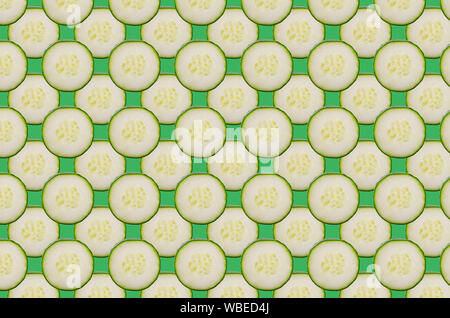 Coral cucumbers slice pattern on colorful background Stock Photo