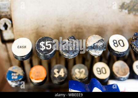 Old black and white damaged keys from a vintage cash register. Stock Photo