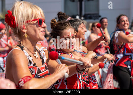 Batala World, Batala Mundo drummers at the Notting Hill Carnival Final Parade on a hot Bank Holiday Monday Stock Photo