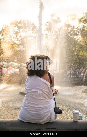 NEW YORK CITY, NY - AUGUST 24, 2019:  Scene from Washington Square Park in Greenwich Village, Manhattan on a summer afternoon. Stock Photo