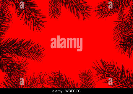 Creative Christmas composition made of green fir tree branches on red background, isolated. Stock Photo
