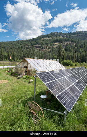 Solar energy panels and greenhouse at the Minam River Lodge in Oregon's Wallowa Mountains. Stock Photo
