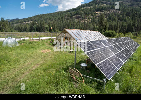 Solar energy panels and greenhouse at the Minam River Lodge in Oregon's Wallowa Mountains. Stock Photo
