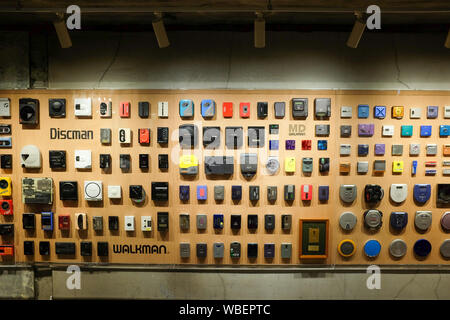 A display of Sony portable audio devices such as the Walkman and Discman. Displayed on the "Walkman Wall" at an exhibition in Tokyo, Japan in 2019. Stock Photo
