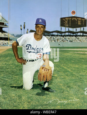 Maury Wills, the star shortstop for the Los Angeles Dodgers throughout the  1960s poses for a souvenir photo on the field of the newly opened Dodger  Stadium circa 1962 Stock Photo - Alamy