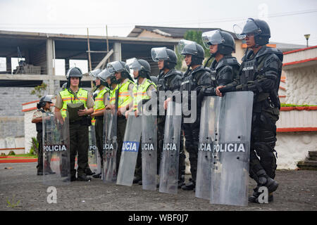 Cuenca, Ecuador - August 13, 2015 - Riot police stand in formation, guarding against potential trouble at a political protest Stock Photo