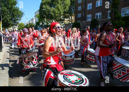 Performers during the parade on the second day of Notting Hill Carnival in west London, Europe's largest street party and a celebration of Caribbean traditions and the capital's cultural diversity. Stock Photo
