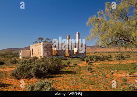 Ruins of abandoned homestead on vast arid plains in outback landscape north of Quorn South Australia under blue sky Stock Photo