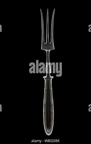 Stainless Vintage Meat or Salad Fork, Carving Dinner Food isolated on black background. Stock Photo