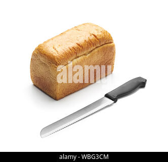 Bread and bread knife on white background Stock Photo