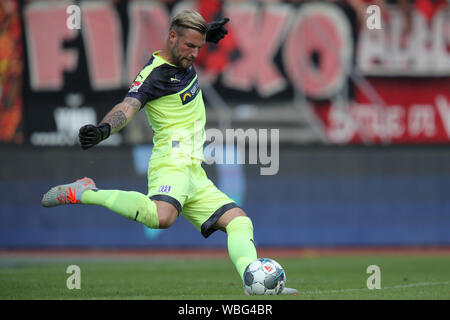 Nuremberg, Germany. 25th Aug, 2019. Soccer: 2nd Bundesliga, 1st FC Nuremberg - VfL Osnabrück, 4th matchday in Max Morlock Stadium. The Osnabrück goalkeeper Philipp Kühn plays the ball. Credit: Daniel Karmann/dpa - IMPORTANT NOTE: In accordance with the requirements of the DFL Deutsche Fußball Liga or the DFB Deutscher Fußball-Bund, it is prohibited to use or have used photographs taken in the stadium and/or the match in the form of sequence images and/or video-like photo sequences./dpa/Alamy Live News Stock Photo