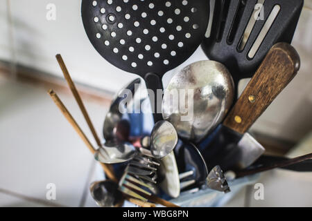 High Angle View Of Various Utensils In Container At Kitchen