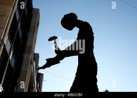 Hammering man in silhouette, a giant sculpture by the American artist Jonathan Borofsky. Basel, Switzerland Stock Photo