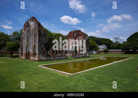 Ruined building and reflection pool at Somdet Phra Narai National Museum and palace in Lopburi, Thailand. Stock Photo