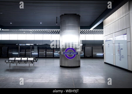 Canary Wharf signage in place on the platform of the new Elizabeth Line at Canary Wharf station in London as the Crossrail project continues to be developed. Stock Photo