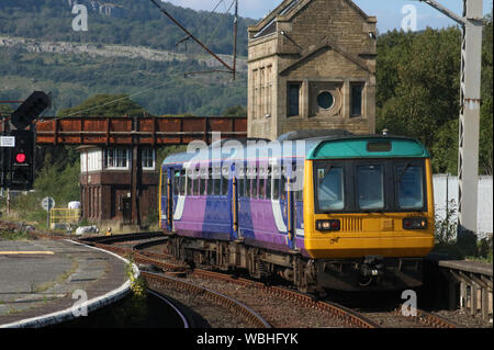 BREL Pacer class 142 diesel multiple unit passenger train in old Northern livery arriving at Carnforth railway station on Monday 26th August 2019.