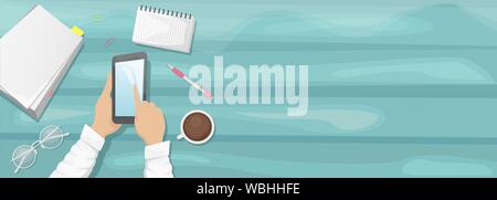 Moody flat lay background with the workplace. Light green wooden background with a stack of paper, eyeglasses, pencil, and laptop. A man holding a smartphone Stock Vector
