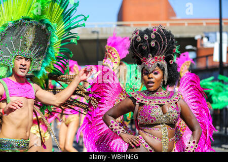 Notting Hill. London, UK. 26th Aug, 2019. Dancers and performers parade on the second day of Notting Hill Carnival in west London. Over a million revellers attend the 2019 Notting Hill Carnival, Europe's largest street party and a celebration of Caribbean traditions and the capital's cultural diversity. Credit: Dinendra Haria/Alamy Live News Stock Photo