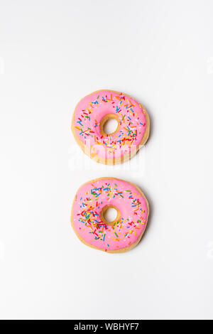 Fresh sweet pink bonuts on white studio background Stock Photo