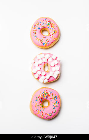 Fresh sweet pink bonuts on white studio background Stock Photo