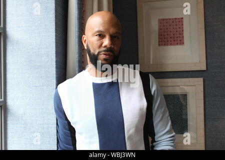 London, UK. 02nd July, 2019. US Rapper Common stands in a hotel. His new album 'Let Love' will be released on August 30th. US-Rapper Common ('I Used to Love HER') is also very busy with other things - as an actor, author, activist and speaker. During the production of his new album 'Let Love', the 47-year-old was able to concentrate fully on the music. (Zu dpa 'New Album 'Let Love' - US-Rapper Common bets on love') Credit: Philip Dethlefs/dpa/Alamy Live News Stock Photo