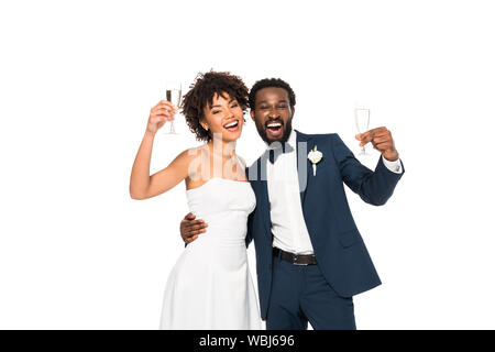 happy african american bride and bridegroom holding champagne glasses isolated on white Stock Photo