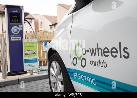 Drivers charge their Electric and Hybrid vehicles at the Princes Street Electrical Charging Station, one of three such stations in the city, in Dundee, Scotland, on 14 August 2019. Stock Photo