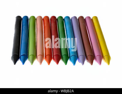 12 multicoloured wax crayons against a white background Stock Photo