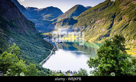 Aerial view on Geiranger town, harbor and fjord in More og Romsdal county in Norway famous for his beautiful boattrip through the fjord. Stock Photo