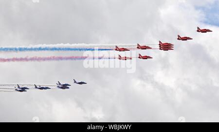 The Red Arrows and the Patrouille de France flying in Concorde formation celebrating the 50th anniversary of its first maiden flight at the 2019 RIAT Stock Photo