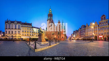 Panoramic view of Rynek square in Wroclaw, Poland with gothic Town Hall and monument at dusk Stock Photo