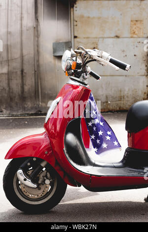 side view of red vwith American flag on handle Stock Photo