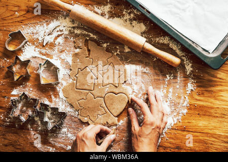 female hands prepare christmas gingerbread cookies Stock Photo