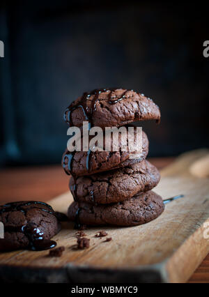 Close-up of homemade chocolate cookies on wooden background Stock Photo