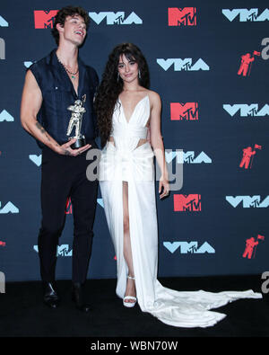 Newarke, USA. 26th Aug, 2019. Singer Shawn Mendes and girlfriend/singer Camila Cabello pose in the press room at the 2019 MTV Video Music Awards held at the Prudential Center on August 26, 2019 in Newark, New Jersey, United States. Credit: Image Press Agency/Alamy Live News Stock Photo