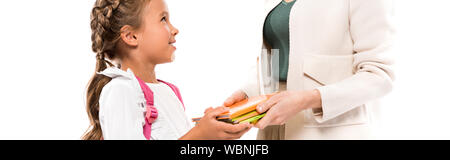 panoramic shot of mother holding books near daughter with backpack isolated on white Stock Photo