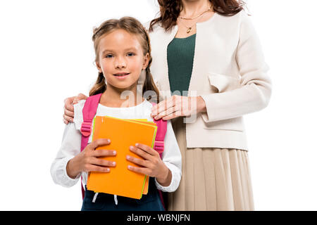 cropped view of mother touching shoulders happy daughter isolated on white Stock Photo