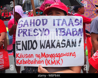 Manila, Philippines. 1st Jan, 2012. A woman holds a placard which says, salaries to be increase, during the demonstration.Thousands of workers took to the streets as the Philippines marked National Heroes' Day. They call it the ''Martsa ng Manggagawa Laban sa Kontraktwalisasyon'' (Workers' March Against Contractualization). They slammed the Duterte Government for allegedly turning a blind eye to the abuses suffered by workers. The United workers calling for an end to ''ENDO'' or end of contractualization of workers and the increase of minimum wage of workers to 750 pesos. (Credit Image: © J Stock Photo