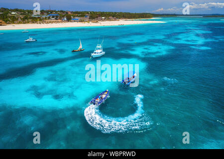 Aerial view of boats and floating water scooter in blue sea Stock Photo