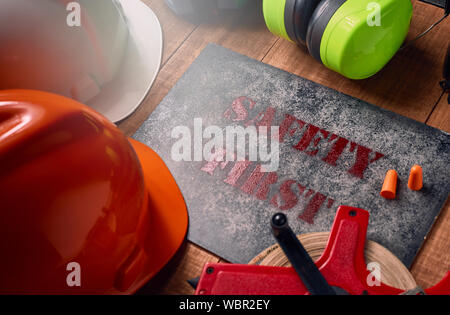 Work safety protection equipment. Industrial protective gear for two on  wooden background. Construction site health and safety concept Stock Photo  - Alamy