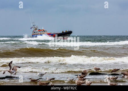 Lifeboat on rescue call, seaside resort of Scheveningen near The Hague, South Holland, Netherlands, Europe Stock Photo