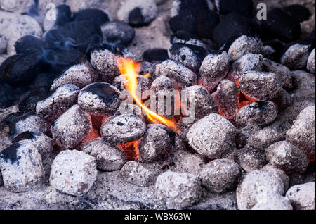 coals burning and heating up for barbecue Stock Photo