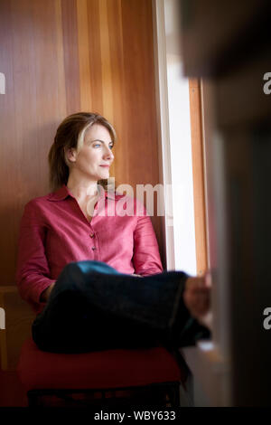 Image of blonde pleased woman thinking and looking upward isolated over ...