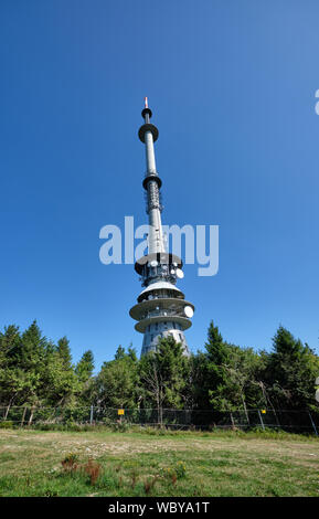 Warmensteinach, Germany - August 22, 2019: The radio and TV tower on the top of the Ochsenkopf mountain in the Fichtel Mountains in Germany against th Stock Photo